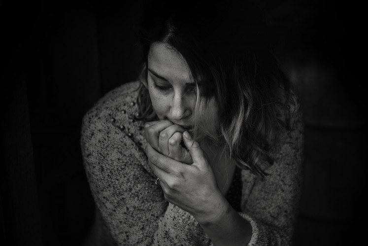 In the dark: Some pig butchering scam victims have experienced depression due to the loss of their money, most of which were their life savings. (Pexels/Kat Smith)