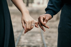 Their two cents: As the new criminal code bill passes, cohabiting might criminalize couples who live together before marriage. A number of couples shared how they feel about the new criminal code. (Pexel/Jasmine Carter)