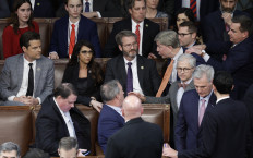 US Rep.-elect Mike Rogers is restrained by Rep.-elect Richard Hudson after getting into an argument with Rep.-elect Matt Gaetz as House Republican Leader Kevin McCarthy walks away, in the House Chamber during the fourth day of elections for Speaker of the House at the U.S. Capitol Building on January 06, 2023 in Washington, DC.
