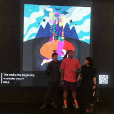 Three’s a crowd: Diela Maharanie shares an irreverent moment with fellow NFT artists Tommy Chandra and Arya Mularama in front of her work “The End is the Beginning“ at the Art Moments Jakarta exhibition. (JP/Tunggul Wirajuda)