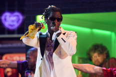 (FILES) In this file photo taken on February 10, 2019, US rapper Young Thug performs during the 61st Annual Grammy Awards in Los Angeles, California. A sprawling gang conspiracy trial involving US rapper Young Thug is expected to begin on January 9, 2023, with prosecutors alleging the Atlanta artist's record label to be a front for a crime ring.
