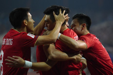 Vietnam's Nguyen Tien Linh (center) celebrates with teammates after scoring a goal during the AFF Mitsubishi Electric Cup 2022 semi-final football match between Vietnam and Indonesia at My Dinh National Stadium in Hanoi on January 9, 2023. 
