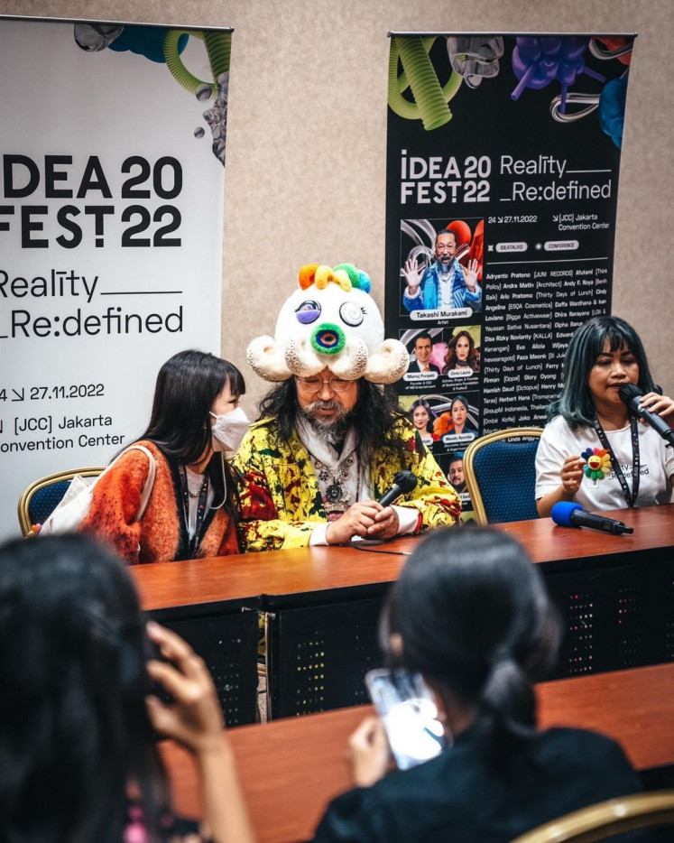 In-depth talk: Takashi Murakami (center) spends some more time with the press backstage after the IdeaFest talk session on Nov. 27, 2022. (Instagram/Courtesy of Takashi Murakami)