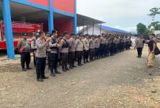 This handout photo taken on Jan. 16, 2023 and released by Morowali Police shows police taking up positions after two workers, including a Chinese national, were killed at a nickel-smelting plant in North Morowali, Sulawesi, after a riot broke out during a protest over labor conditions.
