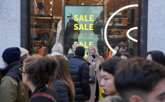 People go shopping, during the traditional Boxing Day sales in London on Dec. 26, 2022.
