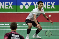 Jonathan Christie hits a return against Denmark's Viktor Axelsen during their men's singles semifinal badminton match of the Yonex Sunrise India Open 2023 in New Delhi on January 21, 2023. 
