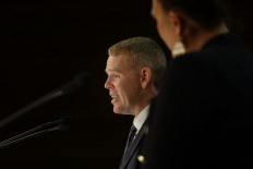 New Zealand's new Prime Minister Chris Hipkins (left) and his Depute Prime Minister Carmel Sepuloni attend their first press conference at Parliament in Wellington on January 22, 2023. 
