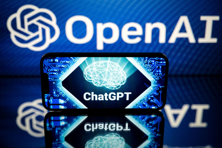 This picture taken on January 23, 2023 in Toulouse, southwestern France, shows screens displaying the logos of OpenAI and ChatGPT.