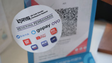 E-wallets require novel use cases as QRIS muscles in: Analysts