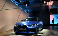 A new BMW i4 car is presented during an event marking the 100th anniversary of the BMW plant in Munich, southern Germany, on May 20, 2022. 