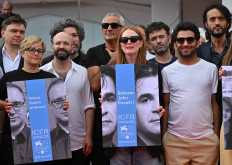 President of the Venezia 79 International Jury, US actress Julianne Moore (C), member of the Orizzonti competition jury, Italian director Laura Bispuri (L) hold on September 9, 2022 a poster showing Iranian director Jafar Panahi, as fellow jury members member of the Orizzonti competition jury, US director Antonio Campos (3rdL), member of the Venezia 79 International Jury, Argentine director Mariano Cohn (3rdL Rear), member of the Venezia 79 International Jury, Italian director Leonardo Di Costanzo (Rear C) join them, asking for Panahi's release, during the 79th Venice International Film Festival at Lido di Venezia in Venice, Italy. Two jailed Iranian filmmakers have issued a defiant challenge to authorities in Iran, vowing in a message to fellow cineastes at the Venice Film Festival that they will not stop creating. Mohammad Rasoulof and Jafar Panahi -- whose film “Khers Nist“ (No Bears) is in competition for Venice's top Golden Lion prize -- have both been behind bars since July amid a crackdown on dissident voices in all sectors of society.
