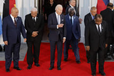 (Left-right) Micronesia President David Panuelo, Fiji Prime Minister Josaia Voreqe Bainimarama, U.S. President Joe Biden, Solomon Islands Prime Minister Manasseh Sogavare and Papua New Guinea Prime Minister James Marape find their places along with other leaders from the Pacific Islands region before taking a photograph on the North Portico of the White House September 29, 2022 in Washington, DC. Biden hosted the first-ever U.S.-Pacific Island Country Summit to bring together leaders from 14 island nations in part to counter China’s influence in the region and to discuss partnerships in climate change, pandemic and economic recovery, war legacies, maritime security and environmental protection. 