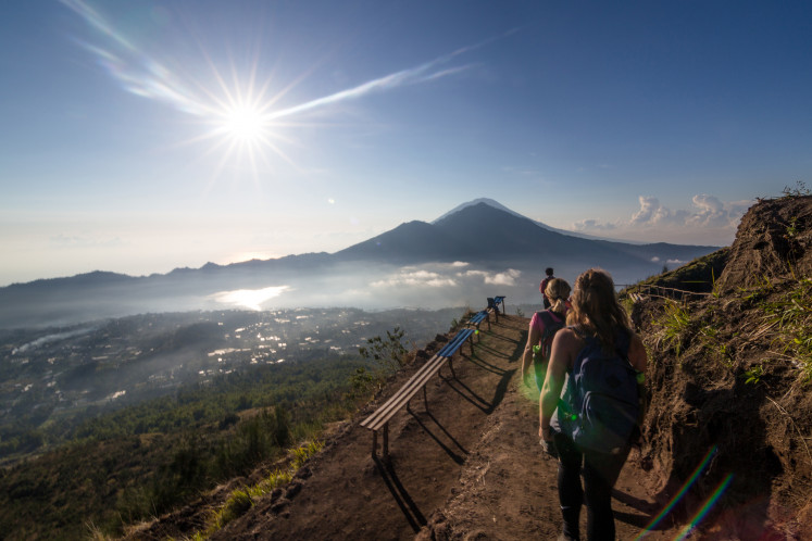 Tourists hike Mount Batur in Bali in this undated photo.