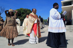 Monsignor Yanuarius Theofilus Matopai You (center) is spotted shortly before he is ordained as the new bishop of the Jayapura Diocese on Thursday in Jayapura, Papua.