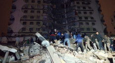 In this video grab from AFP TV taken on February 6, 2023, rescuers search for victims of a 7.8-magnitude earthquake that hit Diyarbakir, in southeastern Turkey, levelling buildings across several cities and causing damages in neighbouring Syria. 

