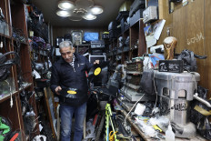 Palestinian Jamal Hemmou shows vinyl records in his shop in the occupied-West Bank city of Nablus, on January 17, 2023. Hemou, 58, is the last of his kind in Nablus in the West Bank city: He runs the only store in Nablus repairing and selling vinyl records and their players. Like much of the world, Nablus is attuned to digital music, but Hemmou told AFP working with vinyl was about preserving Palestinian “heritage.“
