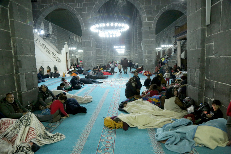 People take shelter at the historical Ulu Mosque following an earthquake, in Diyarbakir, Turkey on February 7, 2023. 