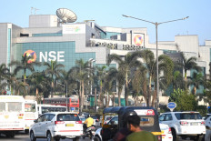 Commuters drive past the National Stock Exchange (NSE) building in Mumbai, India, on Feb. 24, 2022.