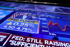 The Fed rate announcement is seen on a screen on the floor of the New York Stock Exchange (NYSE) in New York City, US, on Feb. 1, 2023.