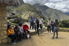 Tourists visit the ancient Inca ruins of Machu Picchu in the Urubamba valley, seventy-two kilometres from the Andes city of Cusco, on February 15, 2023, for the first time after they were closed to the public for security reasons on January 21, after protesters blocked the railways during protests against the government of President Dina Boluarte that have shaken the Andean country since December 7, 2022.
