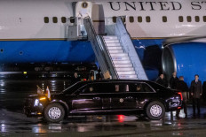 US President Joe Biden leaves the military airport in a car after he landed in Warsaw, to start an official visit on February 20, 2023.
