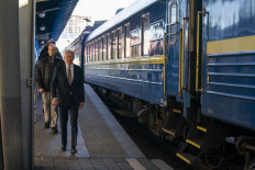US President Joe Biden walks along the train platform after a surprise visit to meet with Ukrainian President Volodymyr Zelensky, in Kyiv on February 20, 2023.
