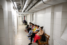 Pregnant women sit in the maternity ward of the Lviv Regional Clinical Hospital during an airstrike alert on December 1, 2022, amid the Russian invasion of Ukraine.