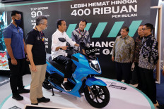 President Joko “Jokowi” Widodo sits on an electric motorcycle of the Alva One brand at the Indonesia International Motor Show, North Jakarta, on Feb. 16, 2023.