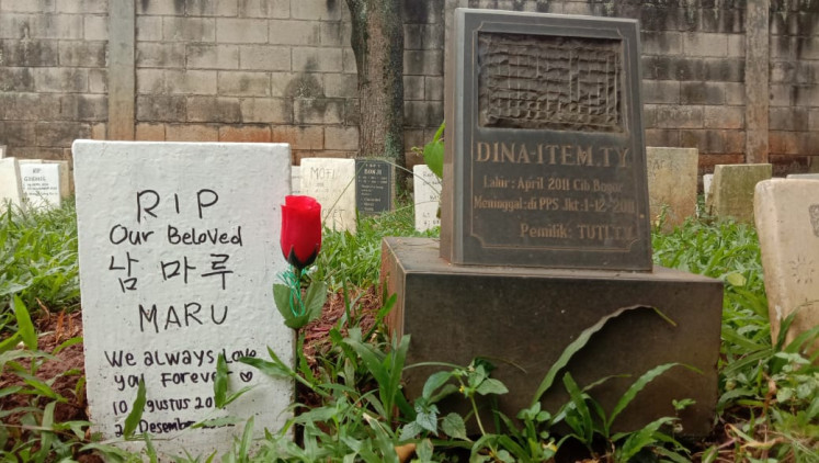 In loving memory: Endearing messages are written on the tombstones at Pondok Pengayom Satwa's pet cemetery in Ragunan, South Jakarta. (JP/Radhiyya Indra)