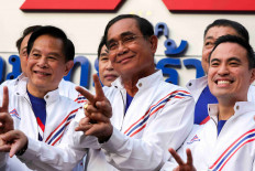 Thailand's Prime Minister Prayuth Chan-ocha, as the PM candidate for the United Thai Nation Party (Ruam Thai Sang Chart Party), poses with his party's members during a welcome ceremony for new members to his party ahead of a general election this year in Bangkok, Thailand, on Feb. 27, 2023.