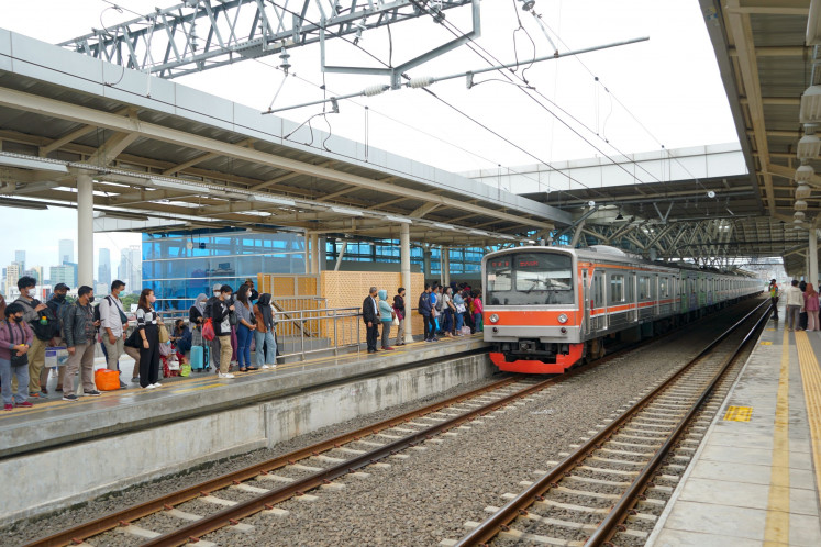 A Commuter Line train bound for Bogor, West Java, arrives at Manggarai Station in South Jakarta on Jan. 3, 2023.
