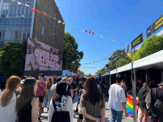 Students walk past stalls during the orientation week at The University of Sydney, in Camperdown, Australia Feb. 15, 2023. 