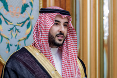 This handout picture released by the Saudi Royal Palace shows Saudi Arabia's Prince Khalid bin Salman, the second son of the reigning monarch, taking the oath as defense minister at al-Salam Royal Palace in the Red Sea coastal city of Jeddah on Sep. 27, 2022.