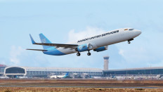 An illustration of a Raindo United Services plane taking off from an airport.