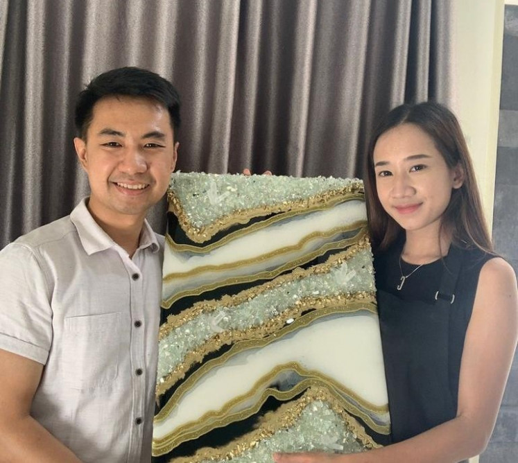 Effort: Reynold Yanuar (left) and Cindy Agnes worked hard to put their work on display. (Courtesy of Cindy Agnes and Reynold Yanuar)