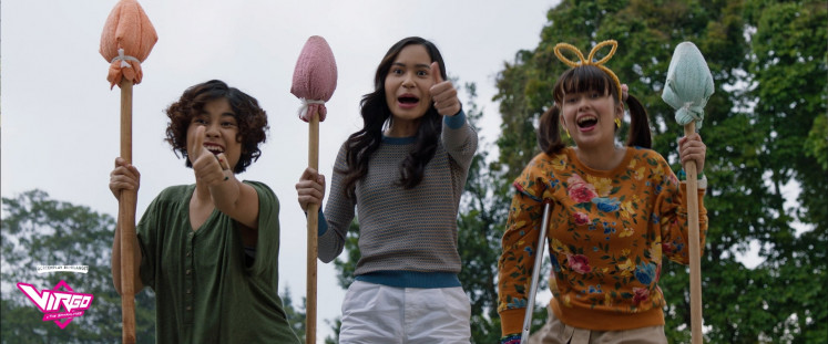 The power of friendship: Riani's friends, Monica (left), Ussy (center) and Sasmi, cheer as they train Riani to control her superpower. (Courtesy of Screenplay Bumilangit)
