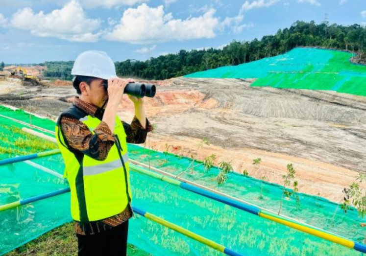 Close look: President Joko “Jokowi” Widodo inspects the progress on a toll road that will lead to the new capital city of Nusantara in East Kalimantan on Feb. 22, 2023.