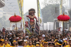 Balinese Hindus parade ogoh-ogoh (giant effigies) on March 12, 2023 during a Car-Free Day event at the Hotel Indonesia traffic circle in Central Jakarta. The parade was held to welcome this year's Nyepi (Day of Silence) and to celebrate the 55th anniversary of the Bali Saraswati School of Arts.