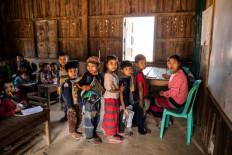 School must go on: Pupils from another village attend a class at Kone Tar village in Namhsan township, northern Shan State on March 9 as their school is being reconstructed after clashes with Myanmar's military. 