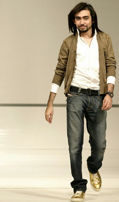 In this file photo taken on March 9, 2007 young Saudi fashion designer Mohammed Ashi strolls onto the stage in Beirut following his show during the final of the TV program 'Project Fashion. Young Arab Fashion Designer' on Lebanese Future Television.