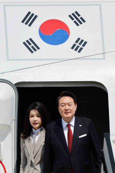 South Korea's President Yoon Suk Yeol and his wife Kim Keon-hee arrive at Tokyo International Airport (Haneda Airport) in Tokyo, Japan March 16, 2023.