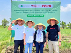EdenFarm executives CEO and founder David Setyadi Gunawan (second left) and Head of Eden Supply Network Oki Harmawan (left) with Telkomsel Mitra Inovasi (TMI) CEO Mia Melinda (second right) and Telkom Digital Ecosystem (INDICO) CEO Andi Kristianto on March 16, 2023 in Brebes, Central Java, after EdenFarm and INDICO signed a memorandum of understanding on Cooperation in the Development of Agricultural Digital Ecosystems.