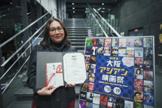 Best picture: Filmmaker Gina S. Noer poses with the award granted for her 2022 film 'Like & Share' during the Osaka Asian Film Festival on March 19. (Instagram/Courtesy of Gina S. Noer)