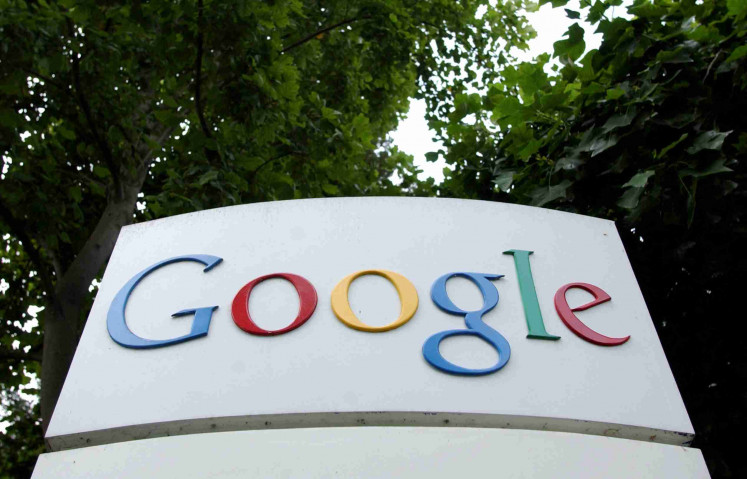 The Google Inc. logo is seen outside their headquarters in Mountain View, California August 18, 2004. 