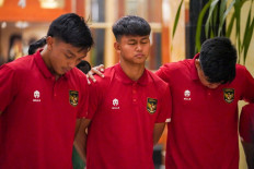 This handout picture taken and released on March 30, 2023 by the Soccer Association of Indonesia (PSSI) shows members of Indonesia's Under-20 team and officials reacting after FIFA announced the cancellation of the Indonesia 2023 FIFA Under-20 World Cup soccer tournament, at a hotel in Jakarta. FIFA announced on March 29 it had removed Indonesia as hosts of this year's U-20 World Cup amid political turmoil over Israel's participation. (AFP/PSSI).