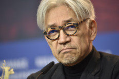 This file photo taken on February 15, 2018 shows Japanese musician and composer Ryuichi Sakamoto, jury member of the 68th edition of the Berlinale international film festival, reacting during a press conference in Berlin. Pioneering Japanese composer and musician Ryuichi Sakamoto has died on March 28, 2023 aged 71, after battling cancer, his management team said in a statement on April 2, 2023. 
