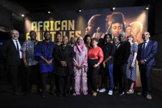 UNESCO Assistant Director General Ernesto Ottone (L), Tanzanian filmmaker Walt Mzengi (3rdL), South African filmmaker Gcobisa Yako (5thL), Nigerian filmmaker Korede Azeez (7thL), Kenyan filmmaker Voline Ogutu (8thL), and Ugandan filmmaker Loukman Ali (11thL), Netflix Director of Local language Films Africa Tendeka Matatu (R) and guests pose for a photocall in the Kenyan capital, Nairobi, on March 29, 2023.