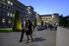 Delegation members are seen at the World Trade Organization headquarters during the 12th WTO Ministerial Conference in Geneva on June 16, 2022.
