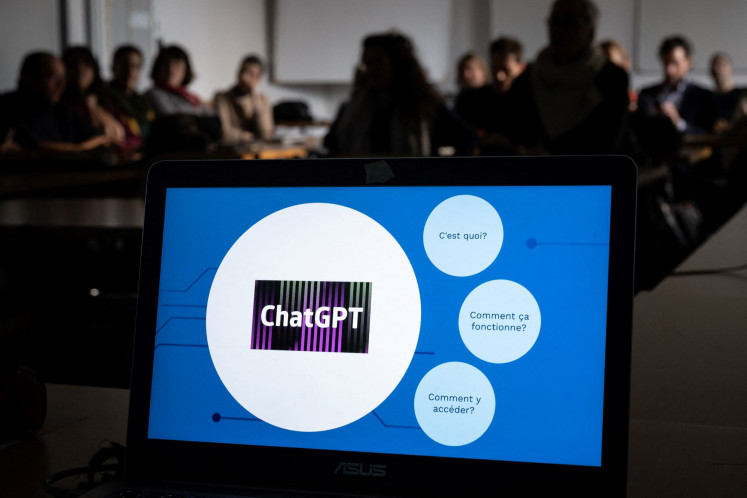 Teachers are seen behind a laptop during a workshop on ChatGpt bot organized for by the School Media Service (SEM) of the Public education of the Swiss canton of Geneva, on February 1, 2023.