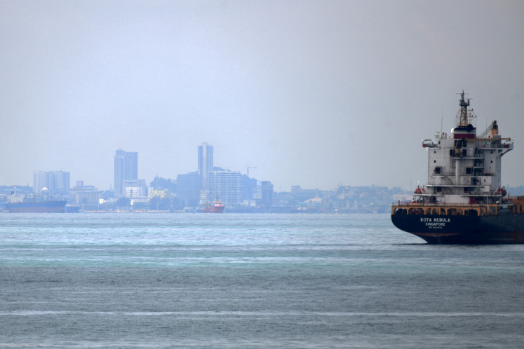 A vessel is seen opposite the Marina Pier in front of Batam island (background) on May 2, 2020, in Singapore.
